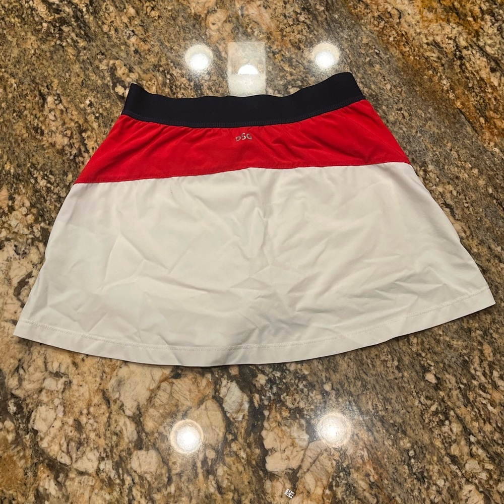 Tennis skirt. Brand is DSG. Colors are red white and blue. It is a size 8-9